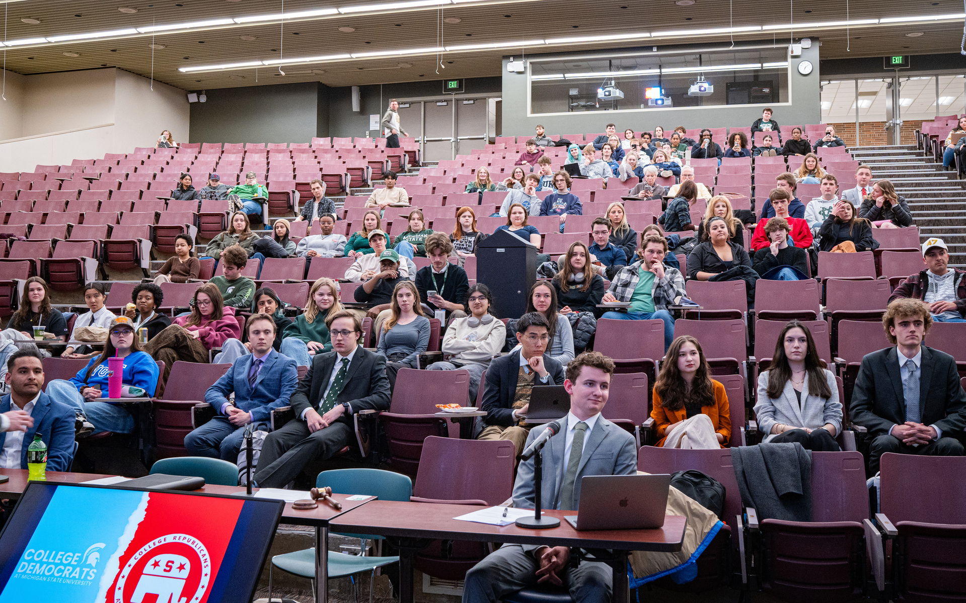 Michigan State University students watch a debate in a lecture hall at Michigan State University.