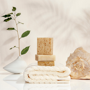 Lifestyle Photography of well being, spa treatment with plant shadows, soap, shell and towel