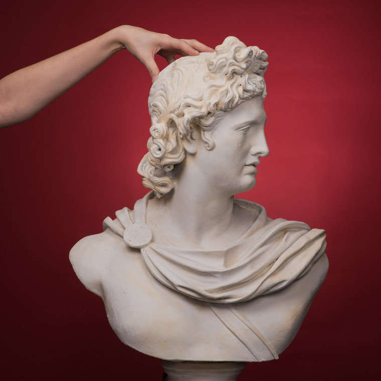 Creative blend of ancient Spartan armor and modern hairstyling captured in a Montreal fashion photo studio