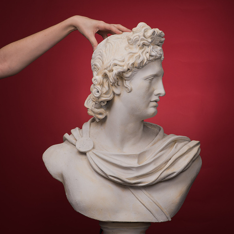 Creative blend of ancient Spartan armor and modern hairstyling captured in a Montreal fashion photo studio