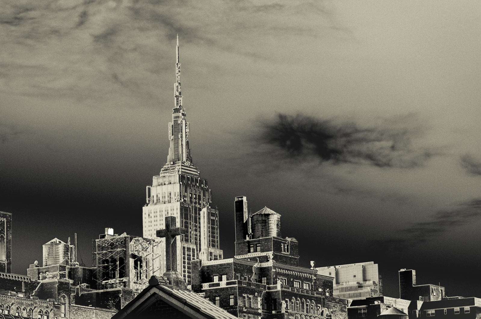 Rooftops in Manhattan with cross on top