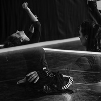 Double exposure of dancers in motion  during a routine in a dance studio