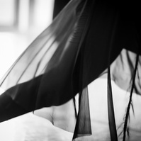 Detail of dancer's sheer skirt while dancing in motion in a dance studio