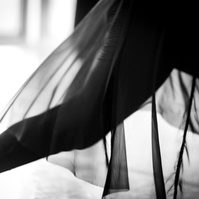Detail of dancer's sheer skirt while dancing in motion in a dance studio