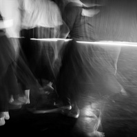 Long exposure of dancers in motion in a dance studio