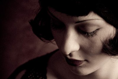 Close-up of vintage young caucasian woman with long lashes