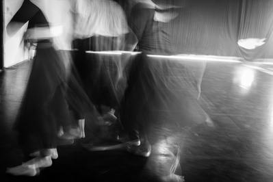 Long exposure of dancers in motion in a dance studio