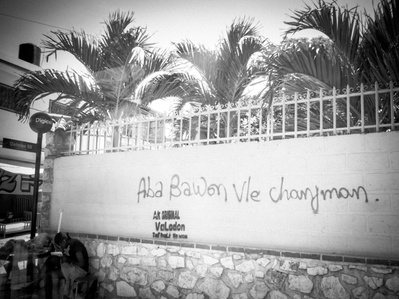 An inscription on a wall in Haiti reading "Haiti needs change"
