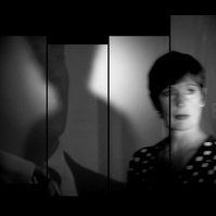 Staggered film strip of woman in her 50’s with short hair in dim light and shadows behind her