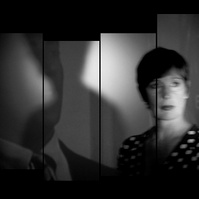 Staggered film strip of woman in her 50’s with short hair in dim light and shadows behind her