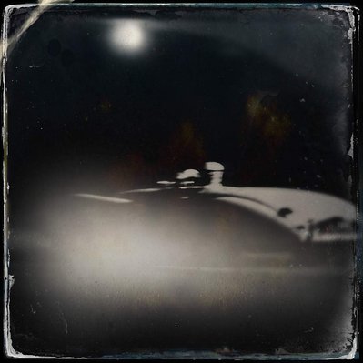 Black and white iPhone tintype of an abstract reflection on a vintage car