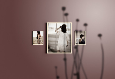 3 framed images on purple wall