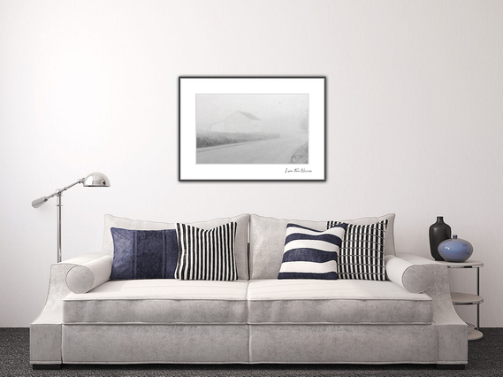 Keeping to the simplicity of the room, this gray toned picture adds to the minimalist ambiance.