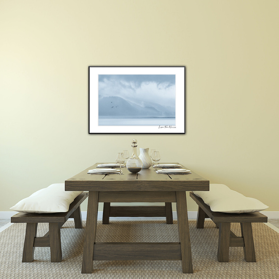 What better way to start your day with breakfast under a frame filled with serenity and birds flying in and out of fog and clouds.
