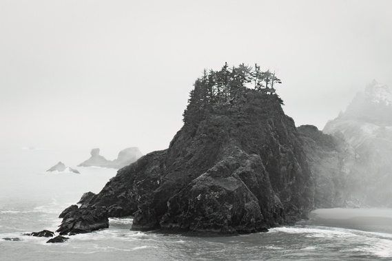 A  very contemporary bedroom lends itself to an atmospheric work of art such as this amazing rock giving life to trees amidst heavy fog and seaspray.