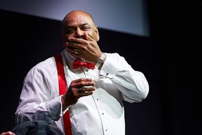 Best corporate kick-off and award ceremony event photographer Josh Caius. This photo was taken at Ham Yard Hotel in London. This is a close up shot of the boss having fun on stage.