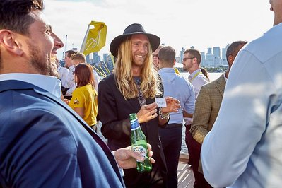 Corporate fun day photography at Sunborn Yacht Hotel by Josh Caius, with magician Magic Mike for a finance firm in London.