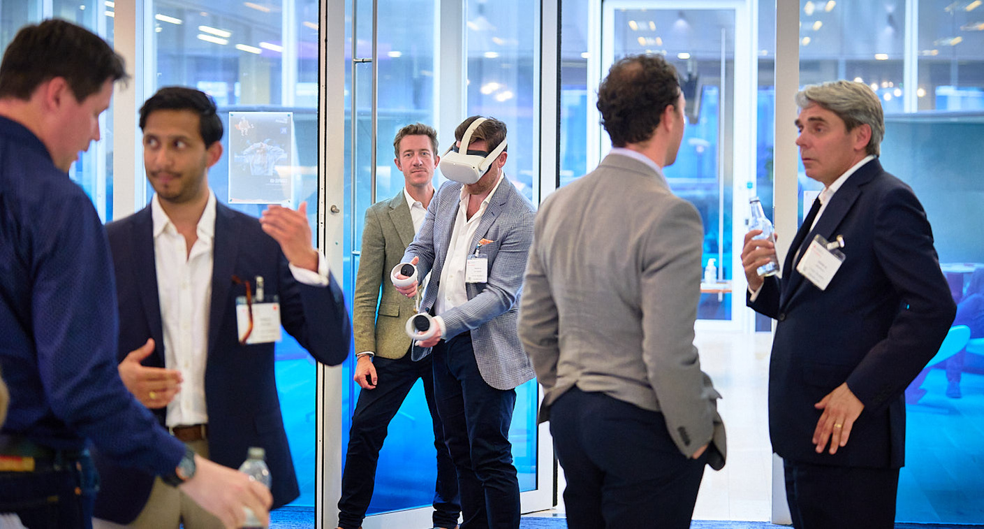 Networking photography during a VR event with speakers and high net worth delegates.