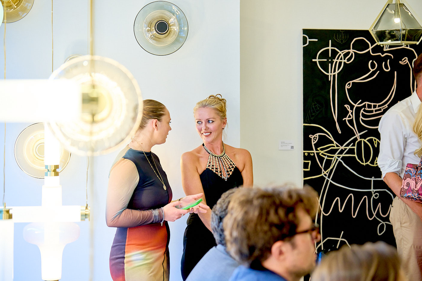 Gabriel Scott capturing a group of people in a room at a networking event in London.
