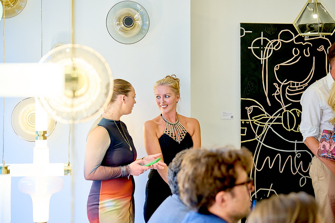 Gabriel Scott capturing a group of people in a room at a networking event in London.