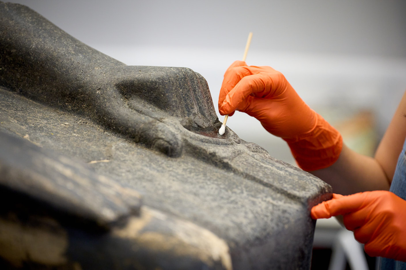 Close up photograph of a conservators hands at The British Museum
