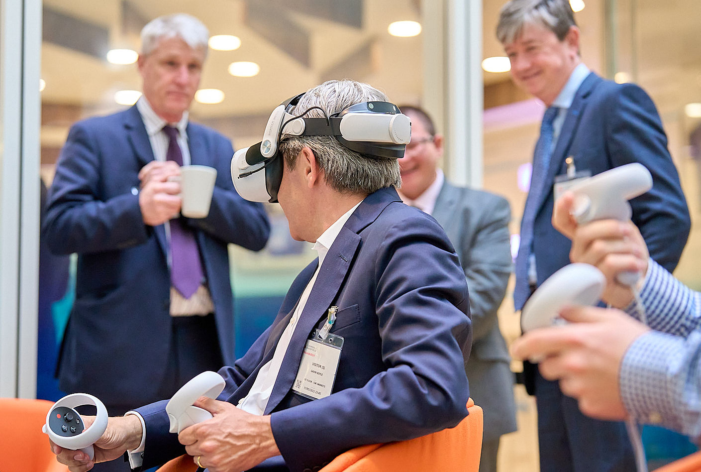 Networking photography during a VR event with speakers and high net worth delegates.