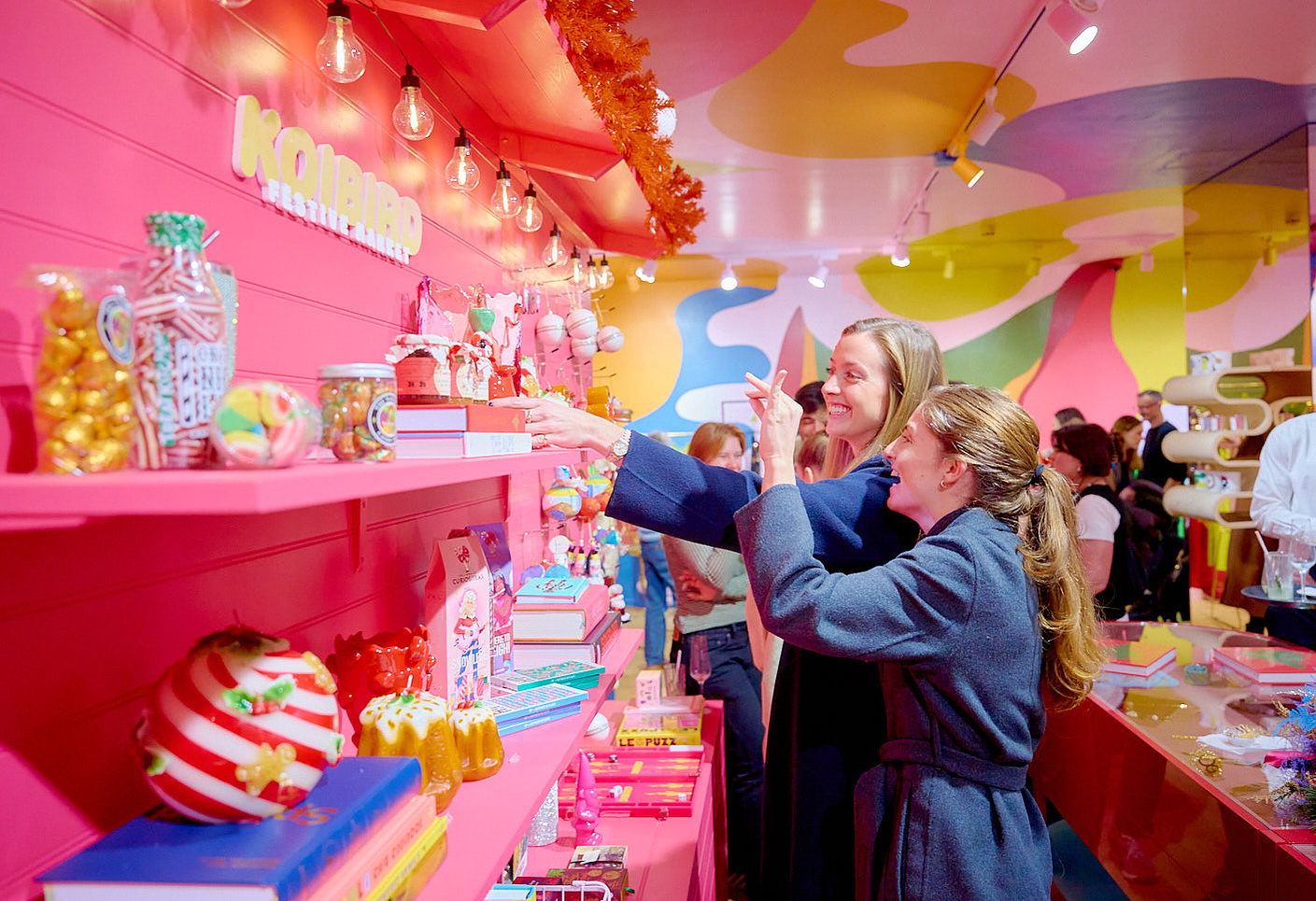 Photo of two women browsing a Christmas shop, photographed by event photographer Josh Caius