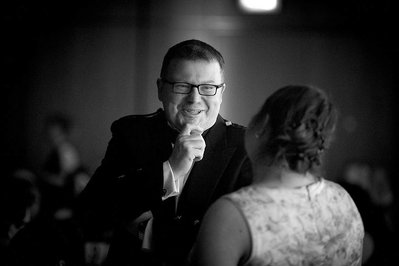 Luxury corporate gala and award ceremony event photographer Josh Caius. This is a natural photo in black and white of people at a formal award ceremony and gala for the end of year celebrations.