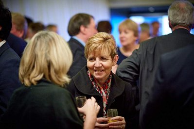 Best corporate award ceremony photographer in London, Josh Caius. This is a candid shot of people enjoying the ceremony.