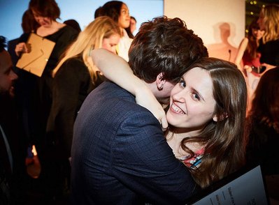 Luxury corporate party and award ceremony event photographer Josh Caius. This is a photo of two award winners embracing after the award ceremony.