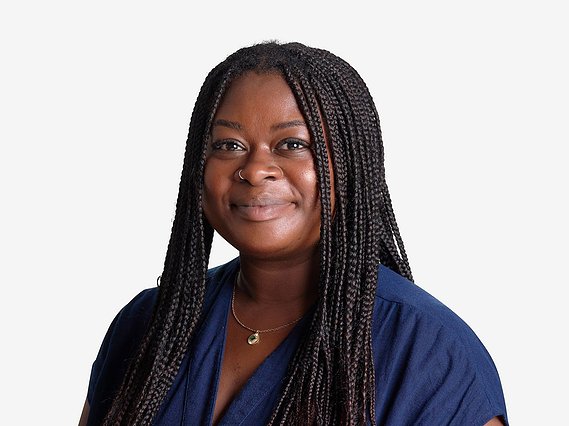White background headshot for charity business Hand in Hand International. Natural relaxed happy headshots.