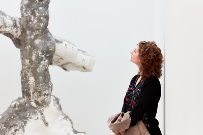 PR photography for The National Gallery in London by Josh Redman. A female student looks carefully at a Phylida Barlow sculpture during an exhibition.