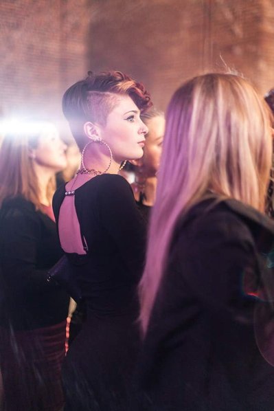 Luxury corporate party event photographer Josh Caius. This is a candid photograph of the audience members at the party.