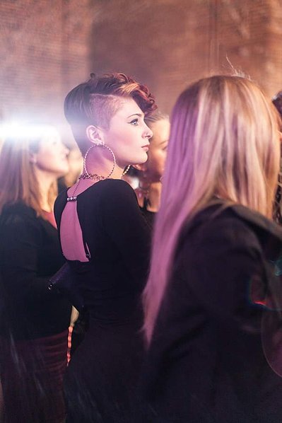 Luxury corporate party event photographer Josh Caius. This is a candid photograph of the audience members at the party.