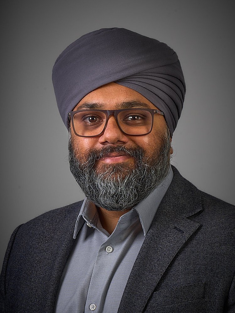 Multi ethnicity corporate headshots with plain background taken in the office in London. 