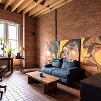 Lounge space at Detroit photography studio available for daily rental with meeting space, dining space, tv, seating area