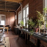 Lounge space at Detroit photography studio available for daily rental with meeting space, dining space, tv, seating area