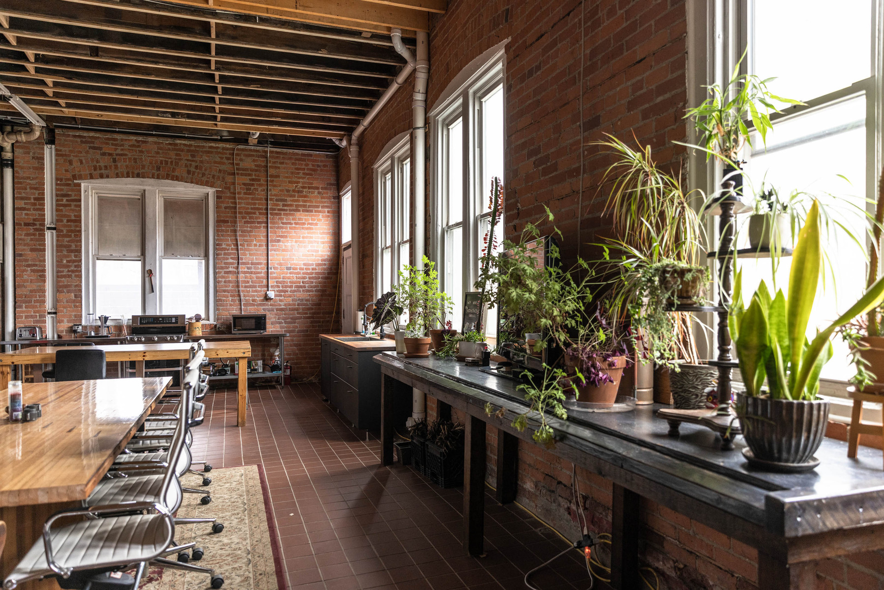 Lounge space at Detroit photography studio available for daily rental with meeting space, dining space, tv, seating area