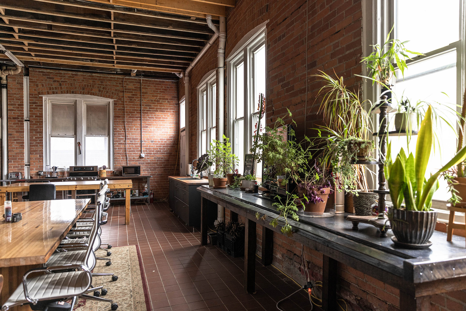 Lounge space at Detroit photography studio available for daily rental with meeting space, dining space, tv, seating area