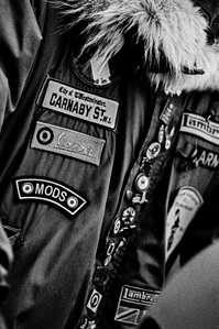 Photograph from Matthew Fleming's 'Mods' (2020) series. Taken at the Ribble Valley Mod Weekender (also known as the Clitheroe Scooter Festival/Rally), Clitheroe, Lancashire. Taken with Ilford HP5 35mm film. 