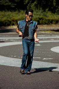 A Rockabilly fan dances in double denim to roller music. Yoyogi Park, Harajuku, Tokyo. 
Photograph from the series Forbidden Colours by Matthew James Fleming. Taken with a Nikon F100 and Kodak Portra 400 35mm film.