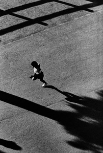 A figure runs at sunset, Odaiba, Tokyo.
From the photographic series "In Praise of Shadows". Shot on black and white film by photographer Matthew Fleming. 