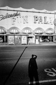 Photograph from the series To Live and Die in Lancashire: Goodbye Pork Pie Hat by Matthew James Fleming. Taken with a Leica M6 and Ilford HP5 35mm film.
The shadow of the photographer is visible in front of the Fun Palace, Blackpool 