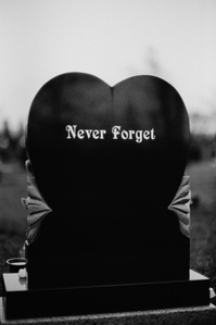 Photograph from the series To Live and Die in Lancashire: Goodbye Pork Pie Hat by Matthew James Fleming. Taken with a Leica M6 and Ilford HP5 35mm film. 
A heart shaped gravestone engraved with "Never Forget", Clitheroe.