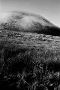 Photograph from the series To Live and Die in Lancashire: Goodbye Pork Pie Hat by Matthew James Fleming. Taken with a Leica M6 and Ilford HP5 35mm film.
Cloud rolls off Pendle Hill, as seen from Barley. 