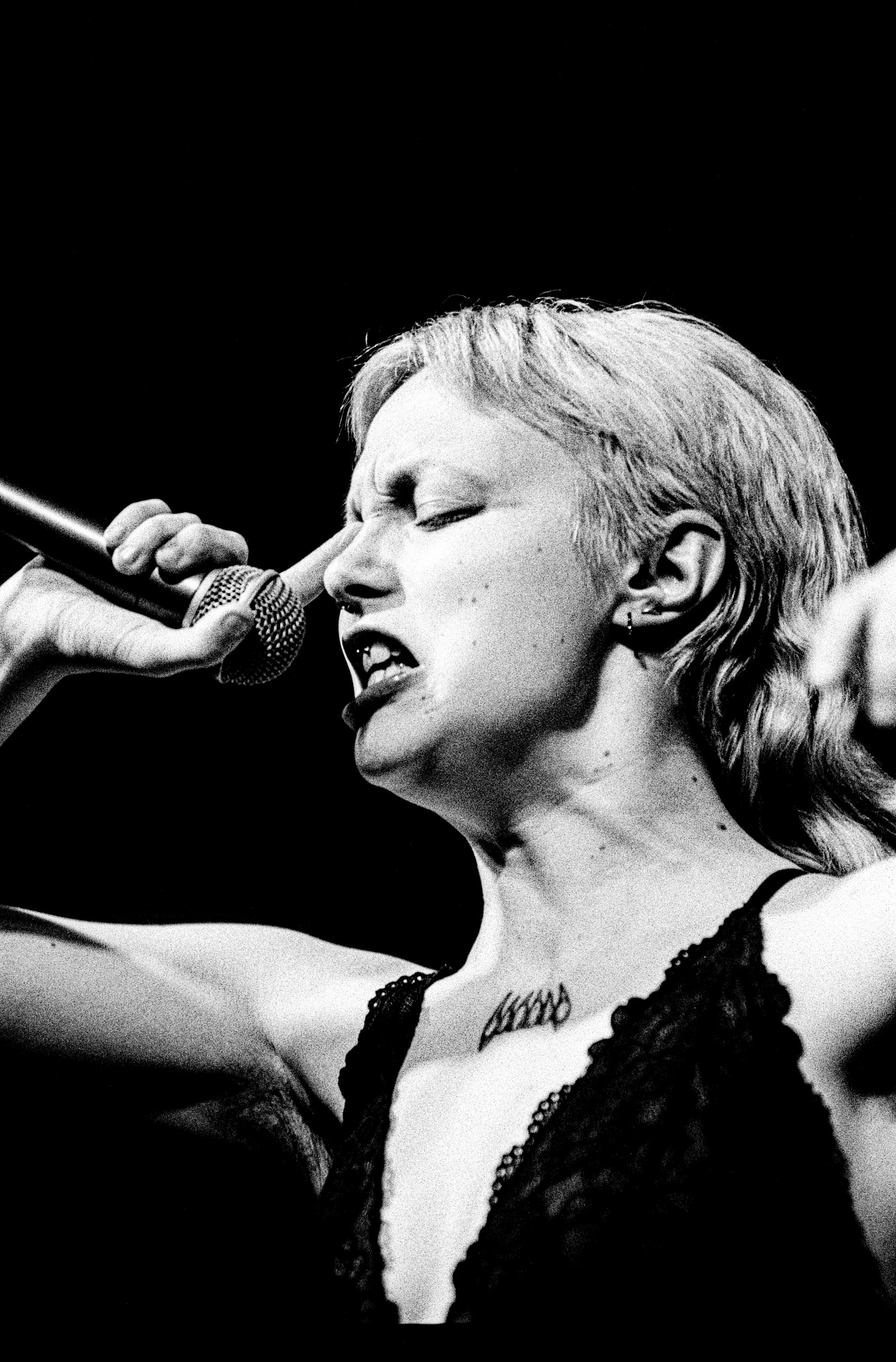 Vocalist of Witch Fever, Amy, seen here performing at Confessional Festival Blackburn, Lancashire.
Photographed by Matthew Fleming on 35mm Ilford HP5 film, with a Nikon F100.