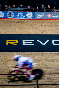 A track cyclist flys around the Manchester Velodrome as part of the Revolution Series of track races. Photo by Matthew Fleming, Lancashire.