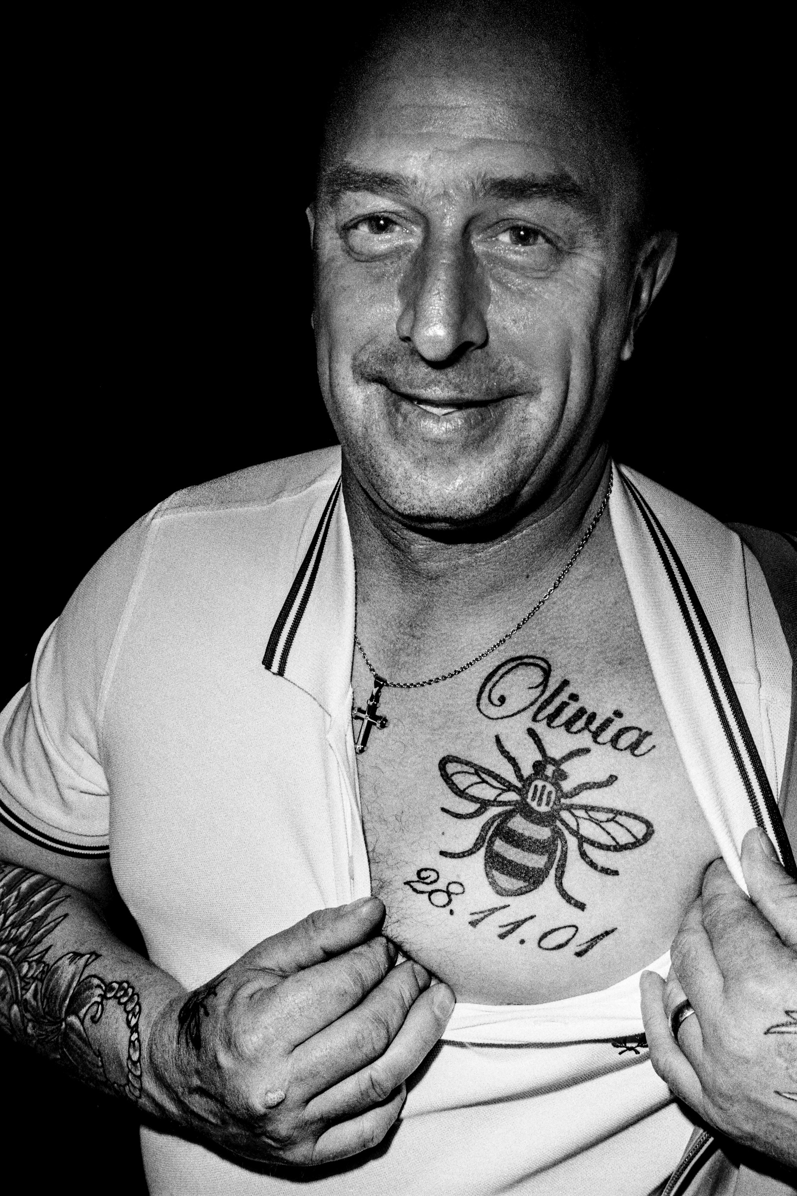 Paul Hodgson, step-father to Olivia Campbell who died in the Manchester Arena Bombing, displays a bee tattoo in her memory. Mod Weekend, Clitheroe, Lancashire, September 2017. Photographed by Matthew Fleming on 35mm Ilford HP5 film, with a Leica M6.