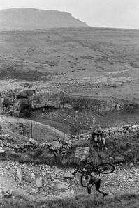 A cyclist runs with bike up Penyghent, part of the Three Peaks Cyclocross (3PCX). Photo by Matthew Fleming, Lancashire.