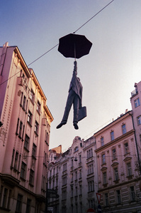 Slight Uncertainty / Hanging Umbrella Man, by artist Micheal Trpak. Prague. Photographed by Matthew Fleming with an Olympus big mini and Fuji Super 400 film. 